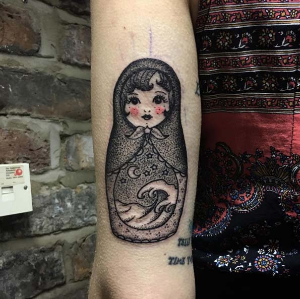 Rosy cheeked nesting doll tattoo by Sarah Whitehouse