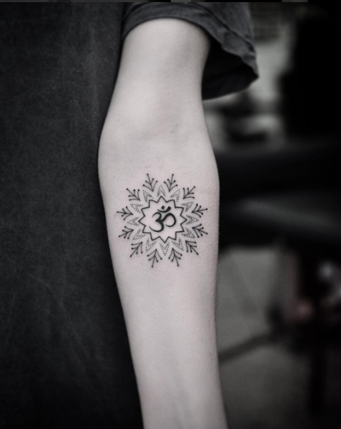 Mandala flower with sanskrit symbol by Chris Jones