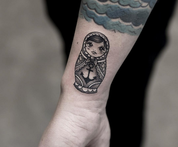 Russian nesting doll tattoo on wrist by Joice Wang