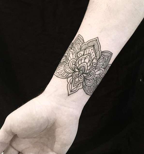Mandala wrist tattoo by Dominique Holmes