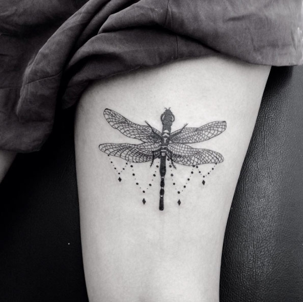 Dangling dragonfly tattoo by Sandra Cunha