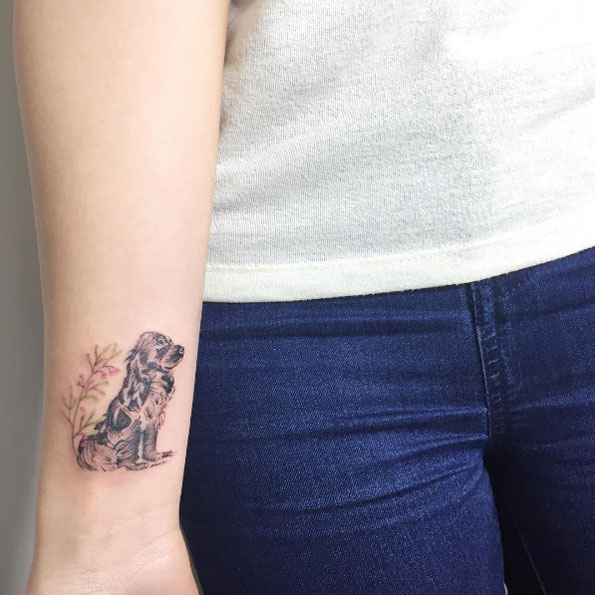 Dog tattoo on wrist by Fatih Odabas