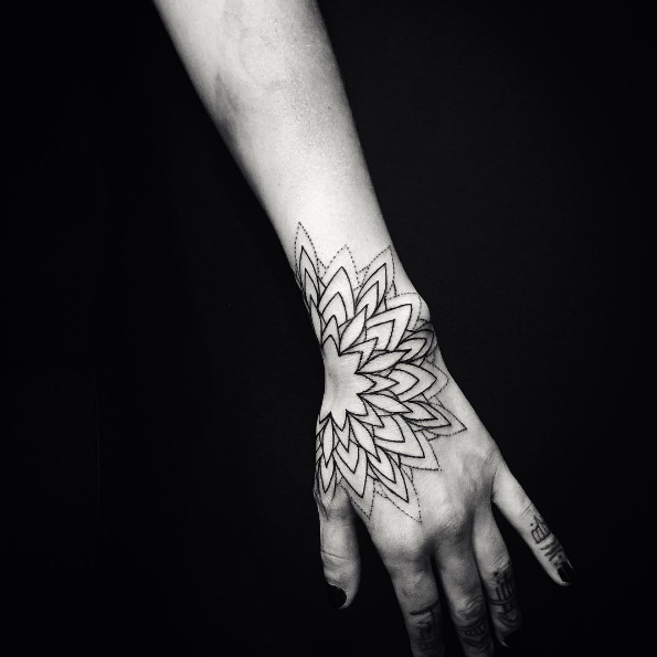Minimalistic mandala tattoo by Alex Treze