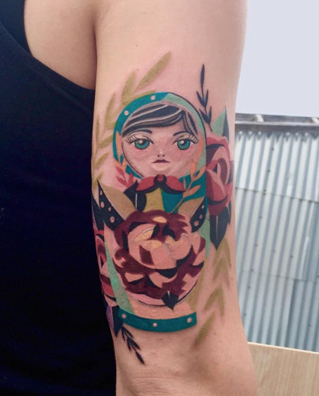 Colorful nesting doll tattoo by Karl Marks