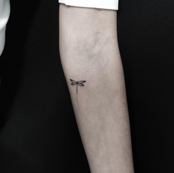 Micro dragonfly tattoo by Fernanda Prado