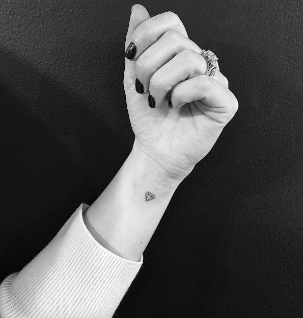 Tiny diamond wrist tattoo by Jon Boy