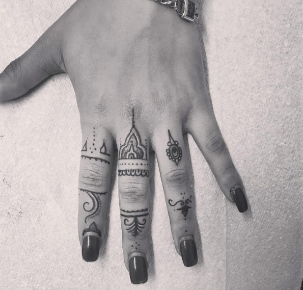 Ornamental knuckle tattoos by Shaks