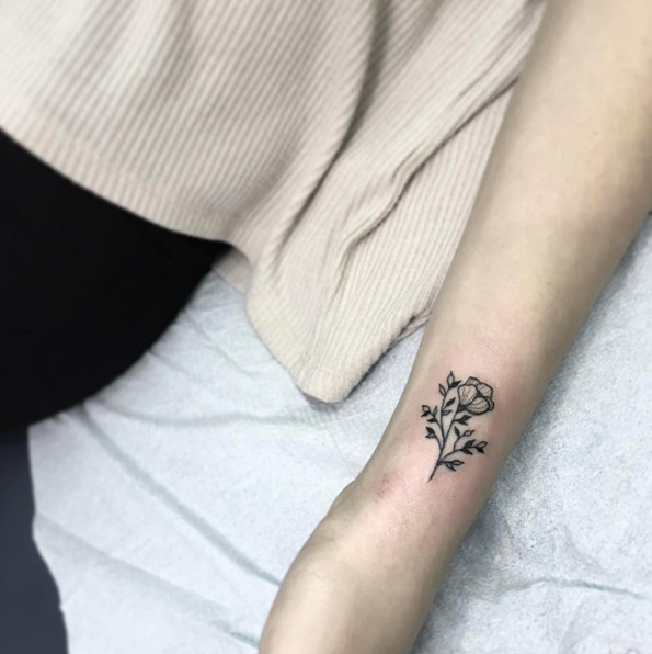 Blackwork floral wrist tattoo by Liana Joy