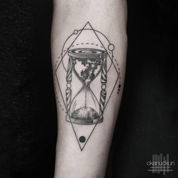 Worldly hourglass tattoo by Okan Uckun