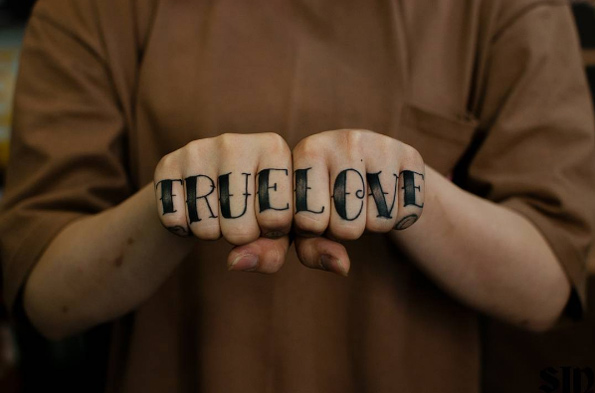 'True love' traditional font knuckle tattoos by SIN