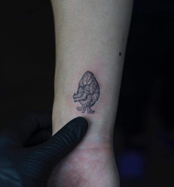 Anatomical heart tattoo on wrist by OOZY