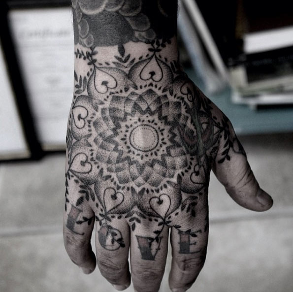 Hand poked mandala flower tattoo on hand by Oliver Whiting