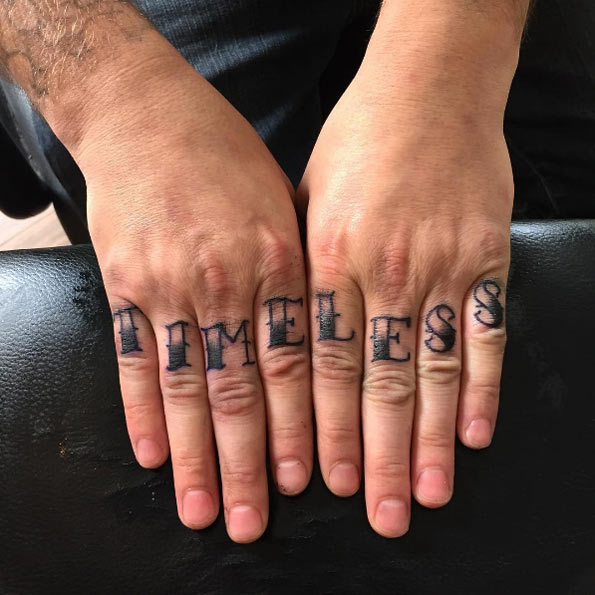 'Timeless' knuckle tattoo by Alex Melrose