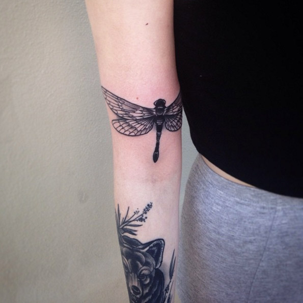 Dragonfly on bicep by Pari Corbitt