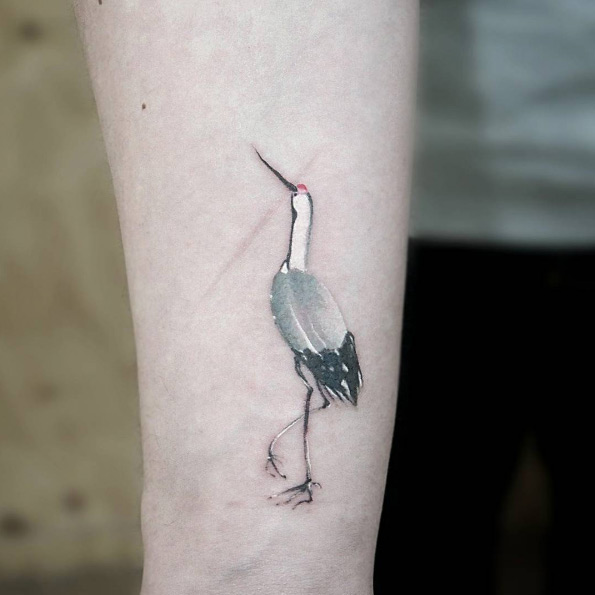 Painted bird tattoo by Tattoo With Me