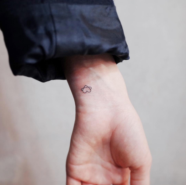 Itty-bitty heart tattoo on wrist by Witty Button