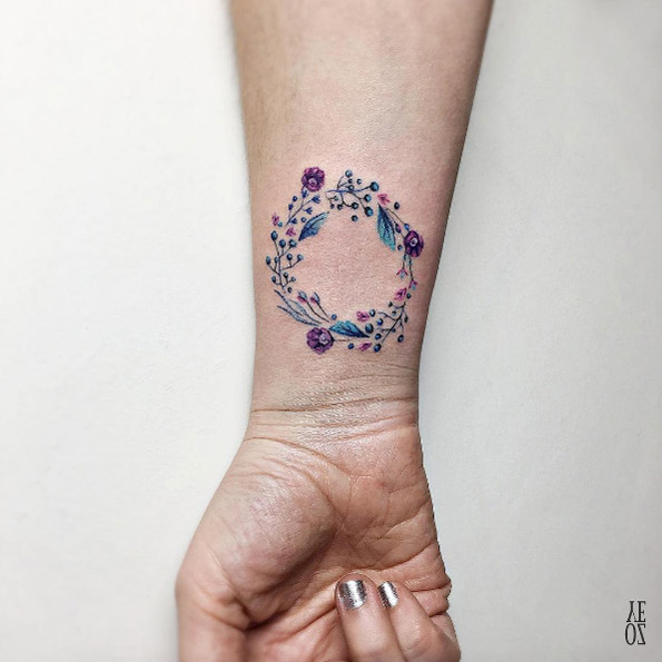Floral wreath wrist tattoo by Yeliz Ozcan