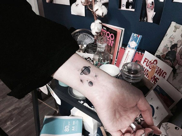Planets on wrist by Blue Whale Ink