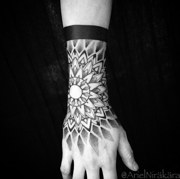 Mandala cuff tattoo by Ariel Nirakara
