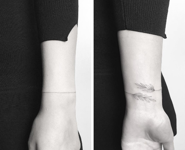 Delicate wrist tattoo by Jakub Nowicz