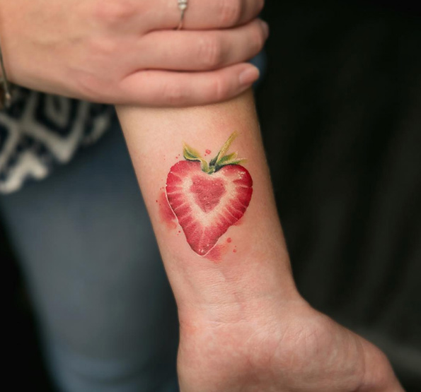 Strawberry wrist tattoo by Joice Wang
