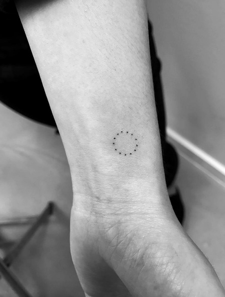 Circle of dots wrist tattoo by Daniel Winter