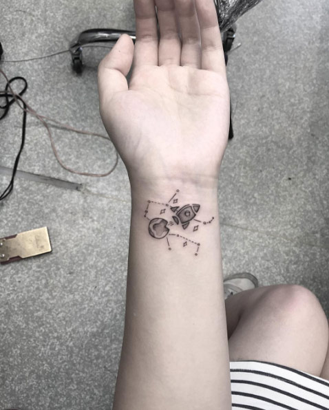 Black and grey ink space tattoo by Bonnie