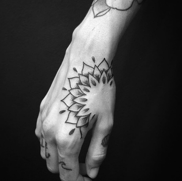 Partial mandala flower tattoo on hand by Alex Treze