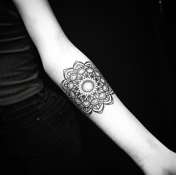 Traditional mandala flower tattoo on forearm by Alex Treze