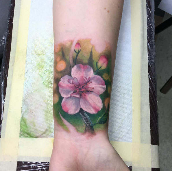 Almond blossom wrist tattoo by Jeremiah