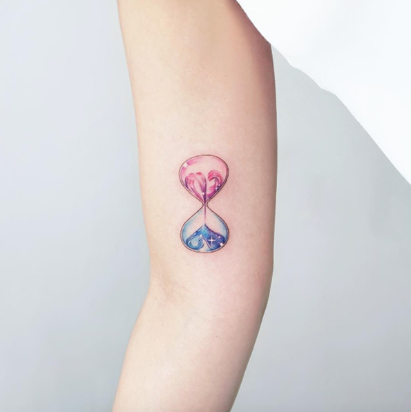 Adorable hourglass tattoo design by Tattooist IDA
