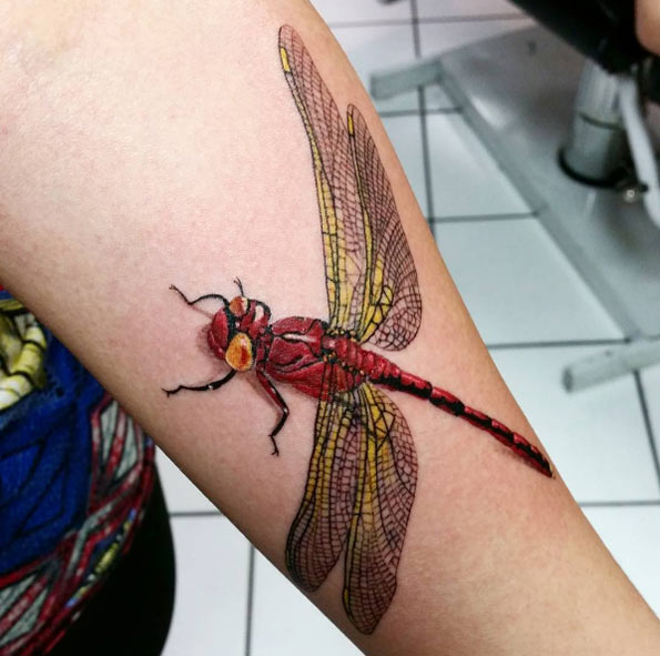 Red and yellow dragonfly tattoo by Faithful Father