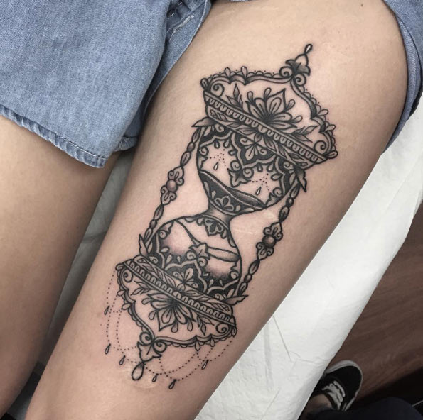 Ornamental hourglass tattoo by Sami Locke