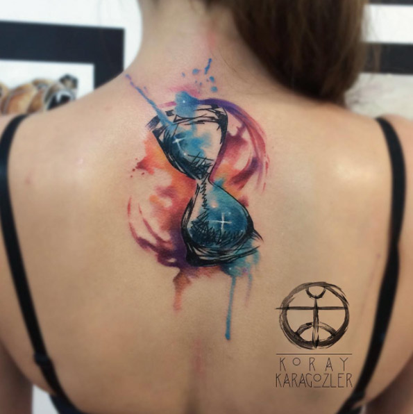 Watercolor hourglass tattoo by Koray Karagozler