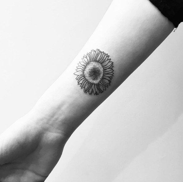 Black ink sunflower tattoo by Carin Silver