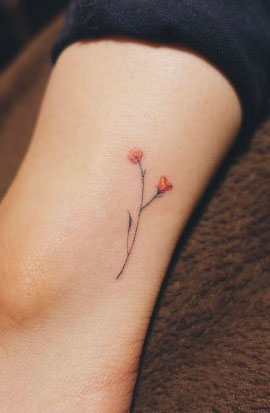 Tiny flower ankle tattoo by Nando