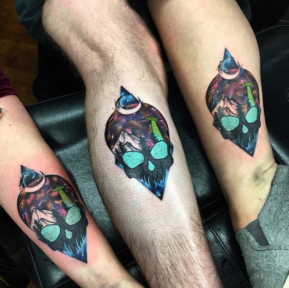 Matching UFO tattoos by Little Andy