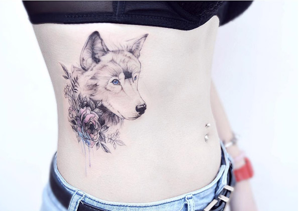Blue-eyed wolf tattoo by Tattooist Banul