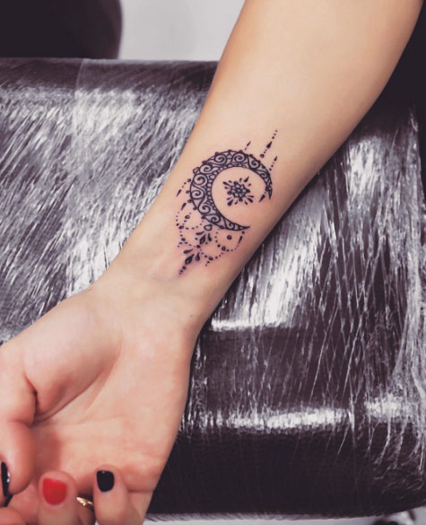 Ornamental crescent moon tattoo by Anna Yershova