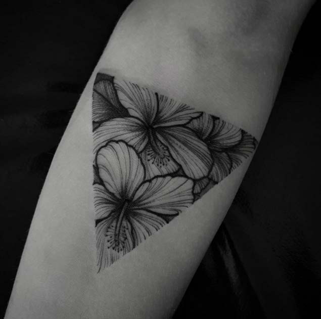 Gorgeous hibiscus triangle tattoo by Felipe Kross