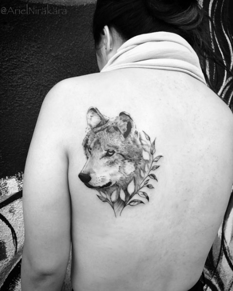 Wolf tattoo on back shoulder by Ariel Nirakara
