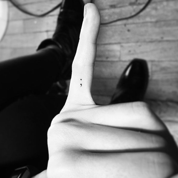 Semicolon finger tattoo by Jay Shin
