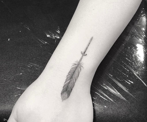 Feather tattoo by Doctor Woo