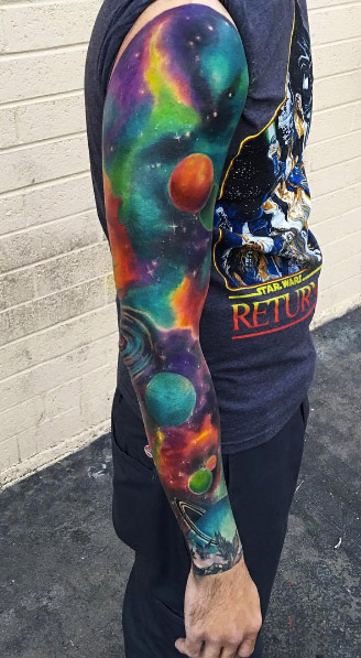 Colorful space sleeve tattoo by Kaitlin Dutoit