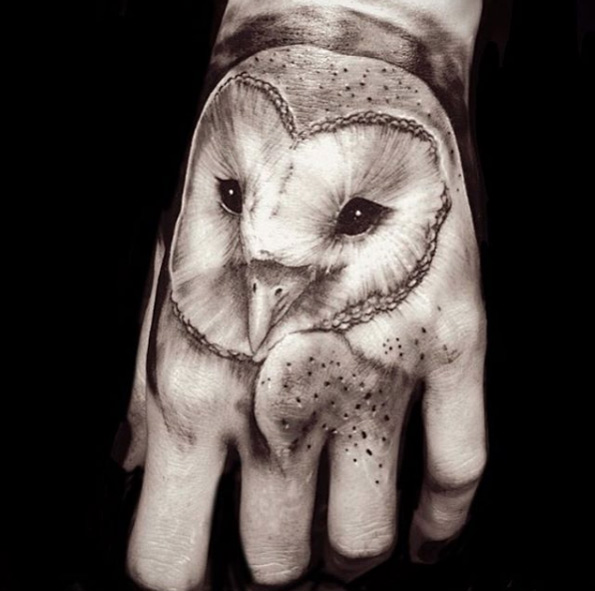 Barn owl tattoo on hand by Greg Sumii