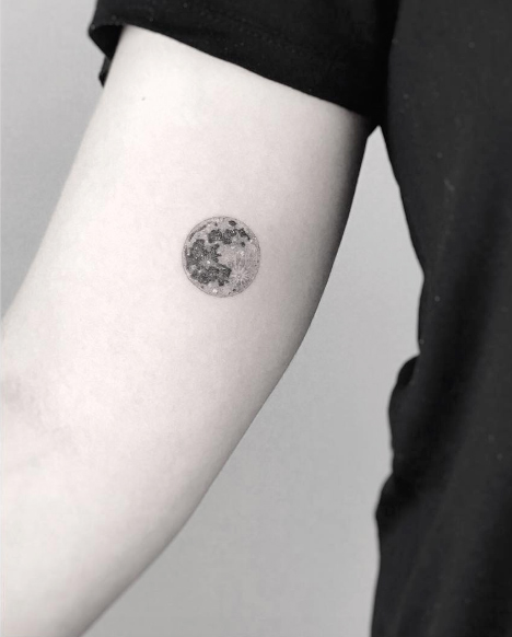 Small moon tattoo by Jakub Nowicz