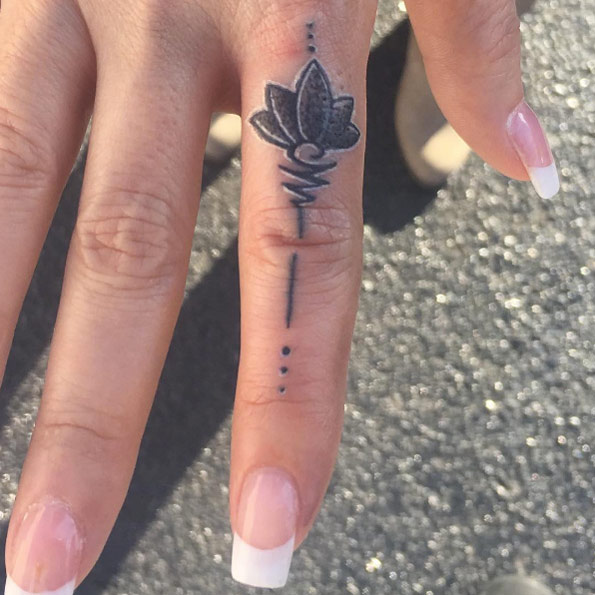 Unalome finger tattoo by Steven Jessee