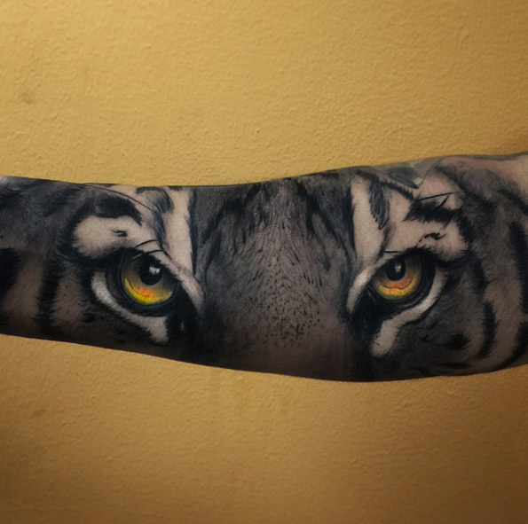 Tiger eyes tattoo by Alex Bruz