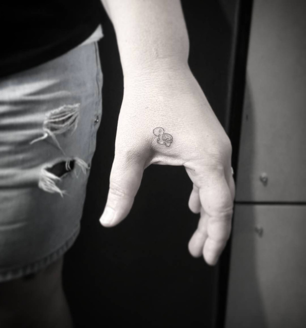 Tiny turtle tattoo by Lilo