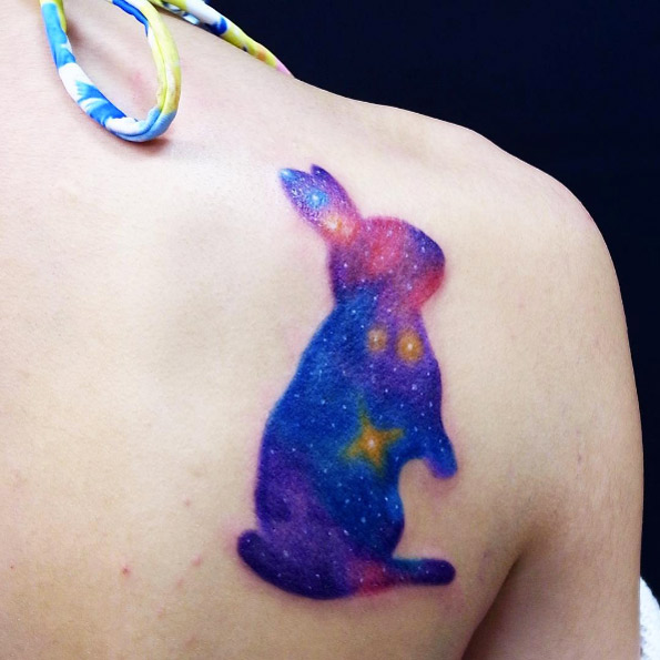 Galaxy bunny tattoo by Stroker Tattoo